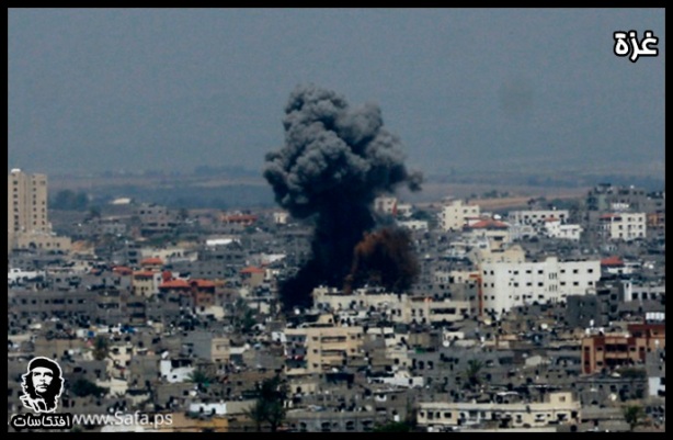 Smoke billows from buildings following an Israeli air strike